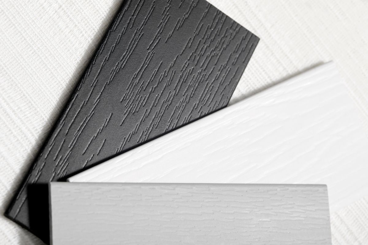 Faux wood blind swatches in espresso, white and grey.