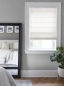 White color Roman Shades in a Bed Room