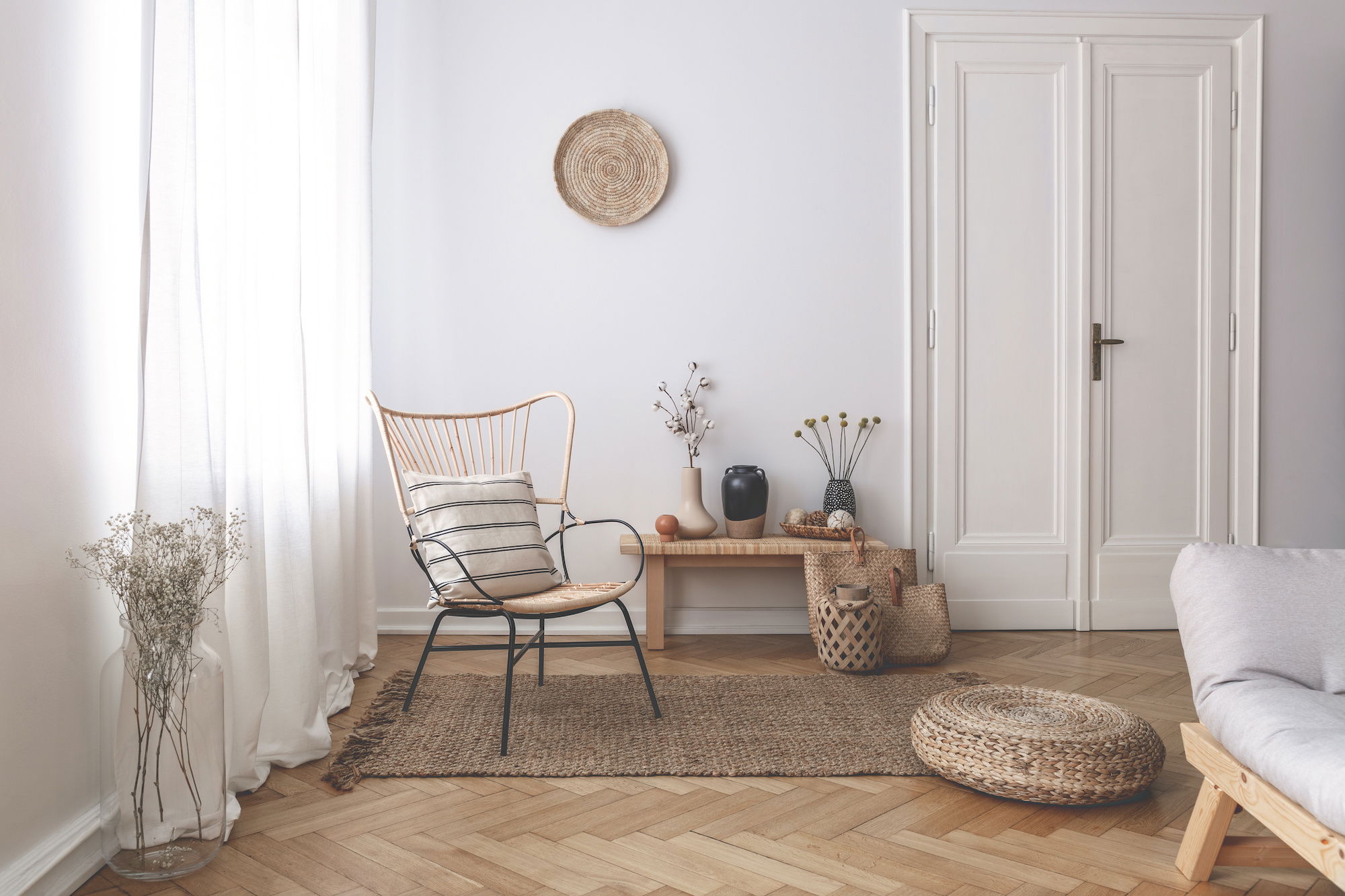 White sheers in a sparsely decorated modern living room.